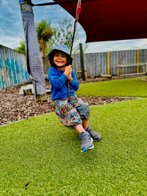 Children playing outdoors together at Ōtipua Grove